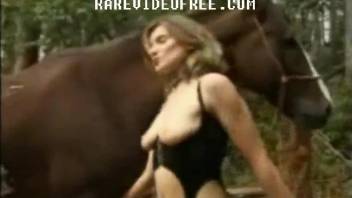 Two astonishing babes are fucking with stallion in farm animality