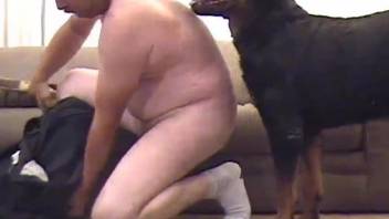 Hormny man feels pleasant with a dog cock in his throat