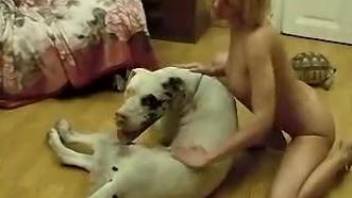 Blond-haired zoophile worships a dog's red cock