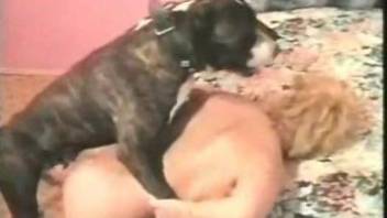 Blond-haired babe with a hairy hole fucks a dog