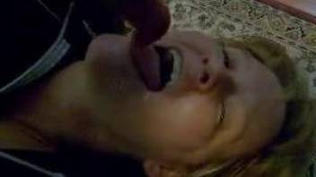 Good-looking blonde MILF gets throated by a dog