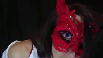 Masked beauty enjoying hot sex with a hung animal
