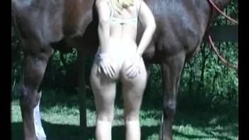Good-looking blonde spreads her legs for a hot stallion