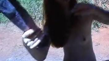 Youthful ginger-haired country lass attempts to have sex with a horse