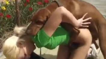 Sexy babe in green top banging a chocolate stud outside